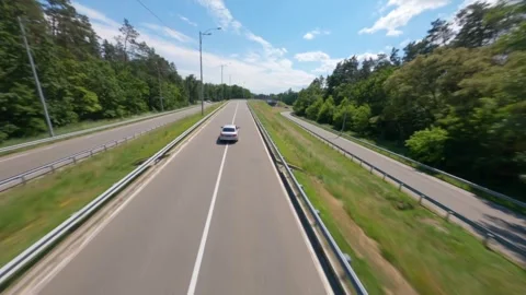 FPV, The car goes on the road. Mixed forest. Road Trip, business car moving Stock Footage 262088013