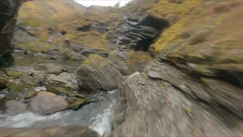 Fpv Cinematic Drone Exploring a rocky stream and Waterfall, Norway Stock Footage 169450307