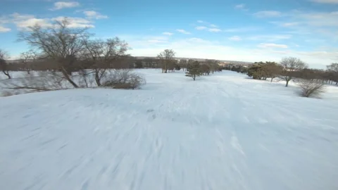 FPV Cinematic Drone Flying Through A Golf Course During The Winter Stock Footage 147954026