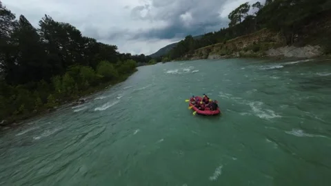 FPV Close Orbit Around Single Rafting Boat on River Stock Footage 309037548