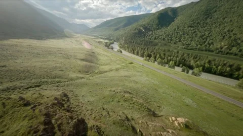 The FPV copter flies at high speed close to the rock rock. Excellent views of Stock Footage 278369190