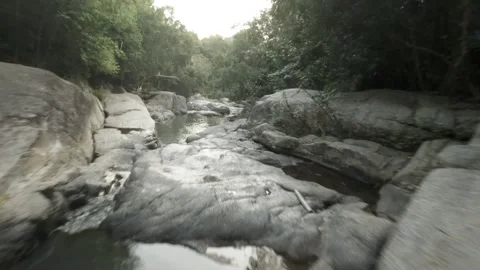 FPV Descent Over Trees to Skim Rocks and Waterfalls Return  Than Sadet Stock Footage 332794365