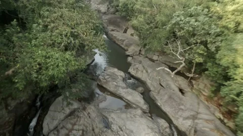 FPV Descent Over Trees to Skim Rocks and Waterfalls  Than Sadet Stock Footage 332794367