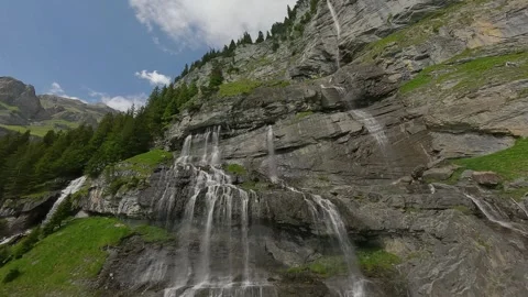 FPV Dive Over Alpine Waterfalls at Oeschinensee, Switzerland (4K) 스톡 동영상 312008262