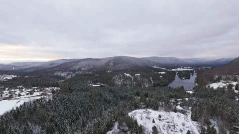Fpv dive toward snowy valley floor Stock Footage 321178472