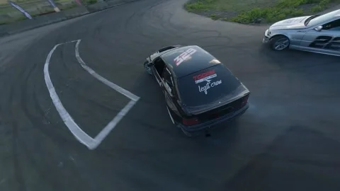 FPV Drift Battle Between Silver BMW and Black BMW Compact in Milovice Stock Footage 328177959