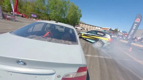 FPV Drift Battle Between Two Cars With Smooth Action and Smoke Stock Footage 328472432