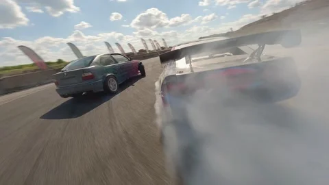 FPV Drift Battle Emphasizing Smoke and High-Speed Precision Stock Footage 328179197