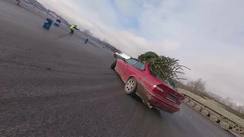 FPV Drift Chase with Christmas Tree on Red BMW, Milovice Stock Footage 324923061