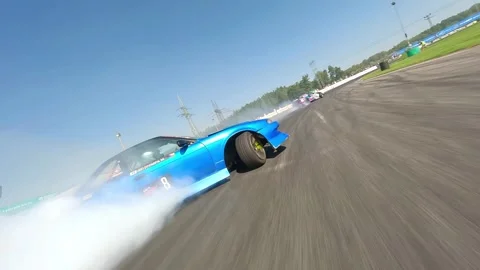 FPV Drift Run Featuring Blue Nissan With Heavy Tire Smoke Vidéo 334170754