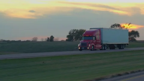 FPV: Driving along the busy heavy traffic highway observing trucks freighting Stock Footage 80486092
