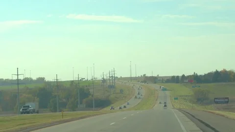 FPV: Driving along the interstate highway surrounded by meadows in Sioux Falls Stock Footage 76015814