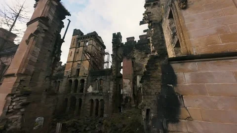FPV drone approach and fly-through of abandoned spooky Lennox Castle in Scotland 動画素材 308791188