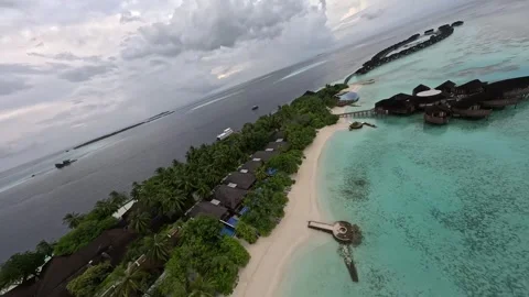 FPV Drone Approaching a Luxury Water Villa Resort in the Maldives Stock Footage 345055848