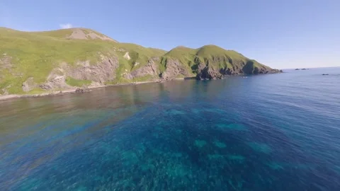 FPV Drone Bird’s-Eye View of Nature Sky-Blue Sea on Rebun, Hokkaido, Japan Video stock 332302035