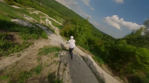FPV Drone Chase Behind Mountain Biker on Trail (4K) Stock Footage 311601508