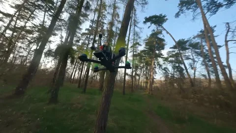 FPV Drone Chasing Another Drone Through Forest in Spring 스톡 동영상 324923819