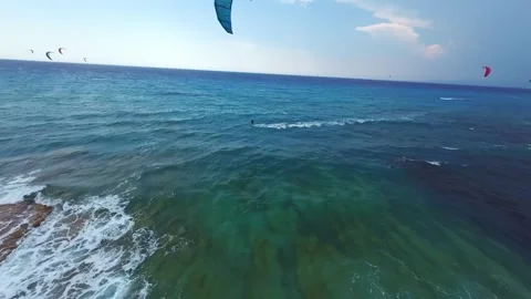 FPV drone chasing kitesurfer riding rough sea in stormy weather Lefkada Greece Stock Footage 329667830