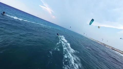 FPV drone chasing kitesurfer riding rough sea in stormy weather Lefkada Greece Stock Footage 329667878