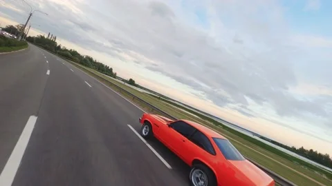 FPV Drone Chasing Musclecar Above The Road Stock Footage 159404432