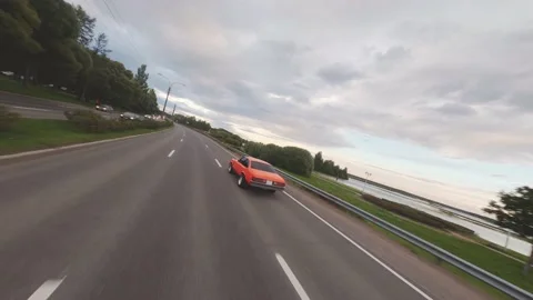 FPV Drone Chasing Musclecar Above The Road Stock Footage 159404458