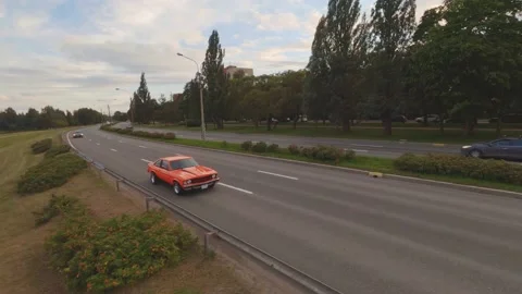 FPV Drone Chasing Musclecar Above The Road Stock Footage 159404493