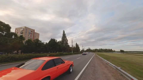 FPV Drone Chasing Musclecar Above The Road Stock Footage 159404528