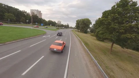 FPV Drone Chasing Musclecar Above The Road Stock Footage 159404529