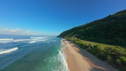 FPV Drone Chasing Ocean Swell at Nyang Nyang Beach, High Speed Flight Along Remo Stock Footage 336638553