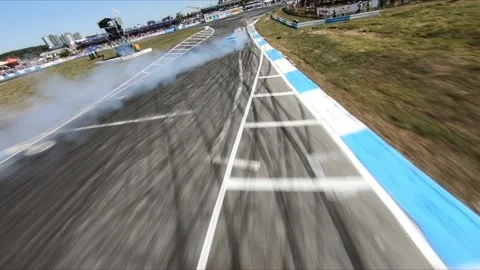FPV drone chasing two drift cars in competition. Slow motion shot. Vídeos de archivo 169410921