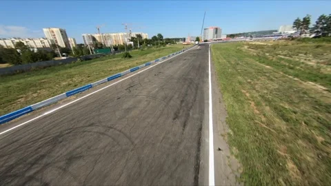 FPV drone chasing two drift cars in competition. Slow motion shot. Vídeos de archivo 169410986