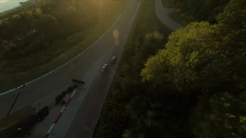 FPV drone chasing two drift cars in competition. Slow motion shot. Vídeos de archivo 169414712