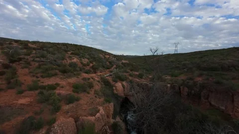 FPV drone cinematic flight over a red rock ravine in Provence Stock Footage 335371399