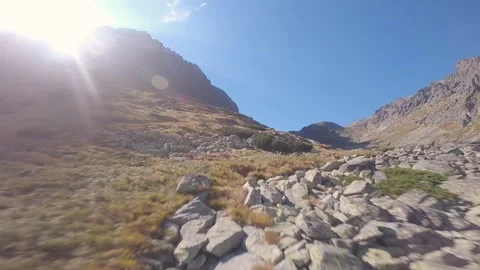 FPV drone cinematic flying close to rocks in high mountains Stock Footage 169280515