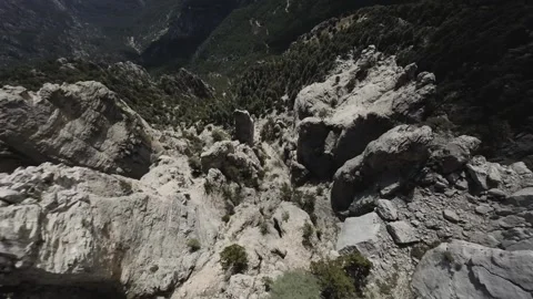 FPV Drone Cliff Dive Revealing Mountains and Sea Stock Footage 309037049
