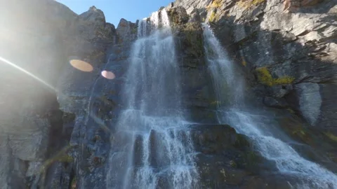 FPV drone Closeby Flying up and Down Fresh water lake and waterfall, Norway Stock Footage 169154129