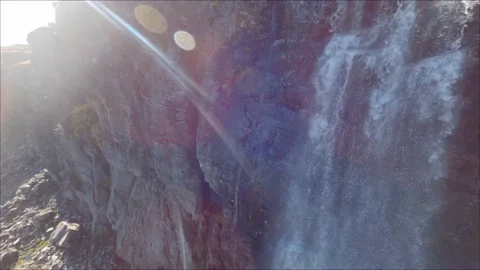 FPV drone Closeby Flying Down Fresh water lake and waterfall, Norway Stock Footage 169154171