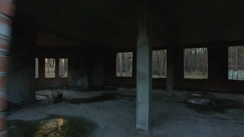 FPV drone crashes. It flights through an abandoned building and autumn forest at Stock Footage 120527643