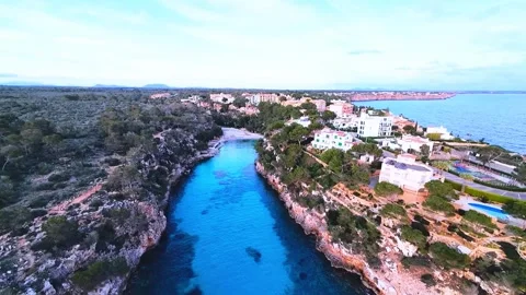 FPV Drone Descent Over Cala Pi Bay at Dusk, Mallorca Video stock 304244008