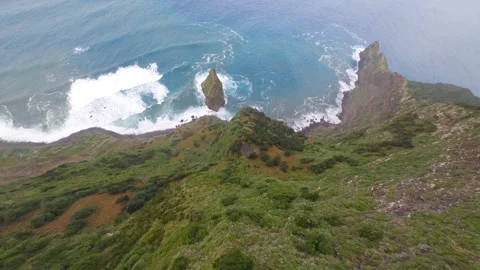 Fpv drone dive along cliff to reach the sea in Madeira Portugal Stock Footage 253555330
