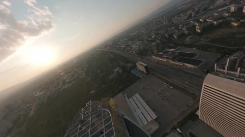 FPV drone dive between modern skyscrapers at sunset in Sofia, Bulgaria. Stock Footage 340201219