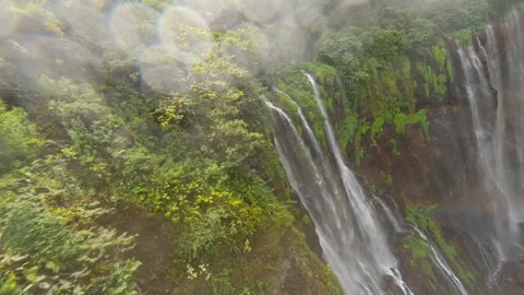 FPV Drone Dive Down Tumpak Sewu Waterfall, Indonesia Stock Footage 327414272