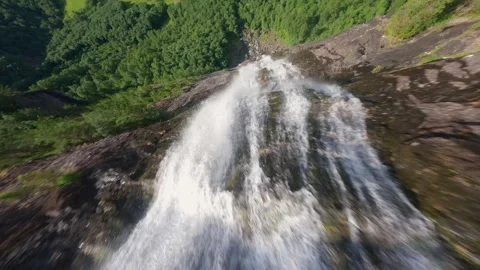 FPV Drone Dive Down Waterfall in Norway – Epic Cinematic Nature Shot Video stock 305803943