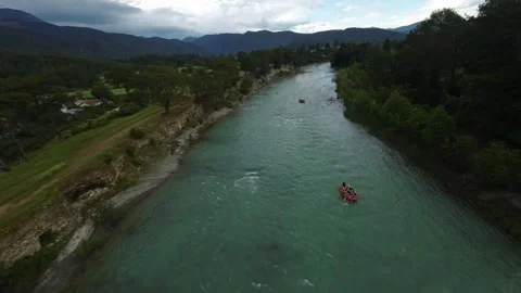 FPV Drone Dive Over Rafting Boats on Mountain River Stock Footage 309037445