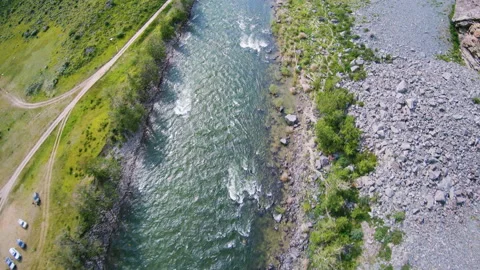FPV drone dive over a rocky river in Altai between the rocks Stock Footage 165966656