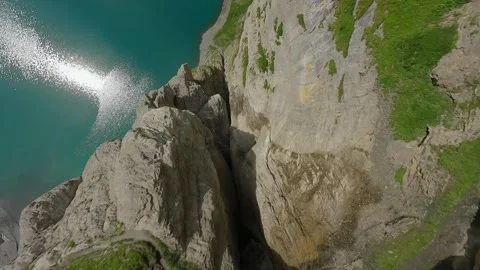 FPV Drone Dive  Rocky Gap Toward Oeschinensee, Switzerland (4K) Stock Footage 312008265