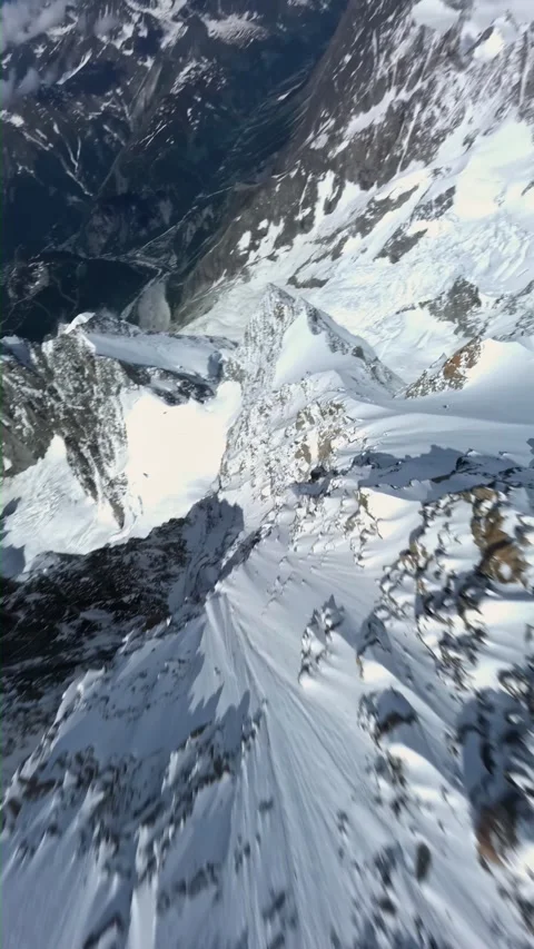 Fpv drone dive snow mountain ridge steep glacier slope high speed flight Stock Footage 340976386