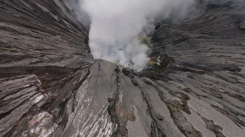 FPV drone dive into steaming Bromo volcanic crater in East Java, Indonesia. Stock-Footage 317504131