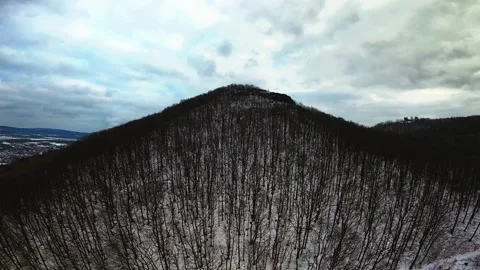 FPV Drone Dive Through Snowy Forested Mountain in Czechia Stock Footage 325738565