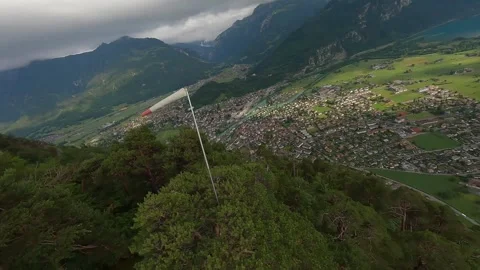 FPV Drone Dive from Wind Sock on Mountain Near Interlaken (4K) Stock Footage 311819511